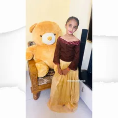 Another look at the custom pleated skirt and off-shoulder top for a young client. This full-length view shows how the two pieces come together to create a comfortable yet stylish ethnic outfit for kids.