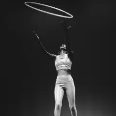 A dramatic shot from my first stage performance, tossing the hoop in the air. That moment of release and catch is always a thrill. This performance was a huge step for me in my hoop journey.