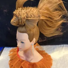 A clearer view of the "hair fish" sculpture. Creating artistic pieces like this allows me to experiment with new ideas and push the limits of hairstyling.