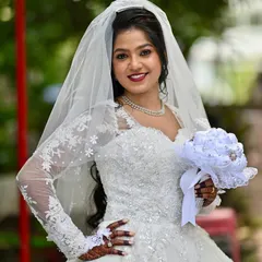 For my Christian brides, I aim for an aura of soft, ethereal glam. This look features a flawless HD makeup base that lasts through vows and celebrations, a defined eye, and a bold lip that complements the pristine white gown, ensuring she feels timeless and graceful.