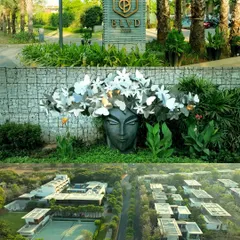 A view of the BLVD CLUB entrance signage and unique art installations, combined with an aerial shot of the villas and grounds.