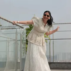 A candid, happy moment captured during a Haldi carnival on a sunny rooftop. This is me in my element, enjoying the celebration just as much as the guests.