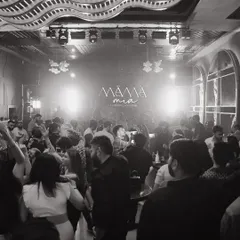A black and white shot of the packed dancefloor at Mama Mia, Indore. The energy was timeless, with everyone lost in the music under the club's unique ceiling design.