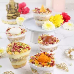 I love giving Indian sweets a modern twist. These fusion dessert jars come in five flavours: Rasgulla, Rasmalai, Motichoor, Kesar Peda, and Gulab Jamun, each layered with cake and cream. They are perfect for festive celebrations.