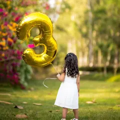 A creative outdoor shot celebrating a third birthday. We love using natural backdrops to create stunning and memorable portraits.