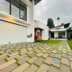A clean, modern aesthetic achieved with our white sectional garage door. This installation shows how our doors can blend seamlessly with contemporary home designs, providing a secure and stylish entrance.