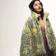 Another look from the "Shiny Disco Balls" shoot, featuring a stunning sequined puffer jacket. I love bold, statement pieces that are as vibrant as the music I play.