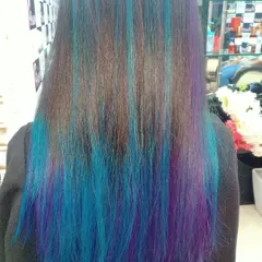 For the truly adventurous, I created this stunning look with vertical streaks of bright blue and purple. This is a bold fashion statement that is sure to turn heads.