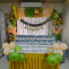 A simple jungle-themed decoration perfect for a home setup. The balloon arch with animal print and character foils is set against a silver shimmer curtain, creating a fun photo corner over the sofa.