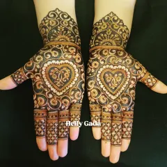 A perfect design for a bridesmaid or sister of the bride. This symmetrical pattern features a beautiful heart motif, filled with intricate details and delicate swirls. It’s a full-hand design that is both elegant and celebratory.