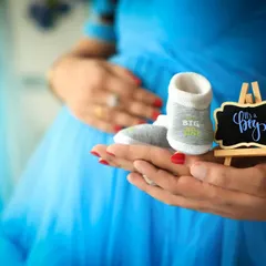 It's all in the details. We use props like tiny baby shoes and "It's a boy" signs to add a personal and heartwarming touch to your photos.
