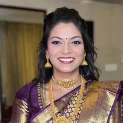 Adorned in vibrant silk and traditional gold jewelry, this South Indian bridal look is all about grace and beauty.