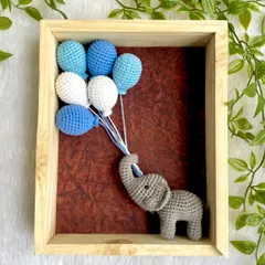This version of my nursery frame features a baby elephant with blue balloons, making it a perfect gift for a baby boy. The wooden frame adds a natural and timeless touch.