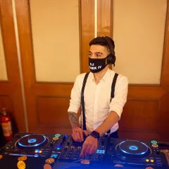 My take on a 'Gatsby' theme for a wedding party, featuring suspenders and a custom mask. I am always excited to participate in themed events and adapt my style to create a more immersive experience.