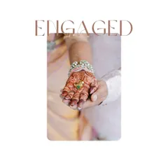 A close-up of the engagement ring, held gently in the couple's hands. This shot symbolizes their commitment and the start of their new journey together.