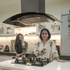 A photo of me with a client in her new kitchen.