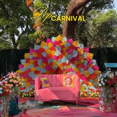 A Haldi ceremony should be an explosion of joy. For Jay and Jinal's 'Pop Carnival' theme, I used a riot of color, quirky pop-art cushions, and a dramatic fan-style backdrop to create a fun, high-energy photo spot that perfectly captured their vibrant personalities.