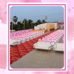 Proper guest seating is crucial for large events. Here, rows of chairs with pink sashes are perfectly aligned, leading the eye down a formal red carpet, ensuring a comfortable and organized experience for hundreds of attendees at a corporate ceremony or presentation.