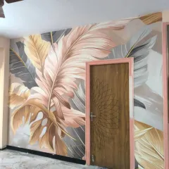 A large-scale tropical leaf mural with soft pastel tones. This custom design adds a modern, artistic touch to the room, and I made sure to wrap it seamlessly around the door frame.