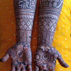 This fun design was for a family eagerly awaiting their little one. We included "Baby Girl" on one arm and "Baby Boy" on the other, with tiny footprints and baby-related motifs on the palms.