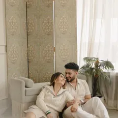 A cozy, indoor pre-wedding shoot that feels like a lazy Sunday morning. We create a relaxed atmosphere where you can just be yourselves, resulting in photos that are honest and full of warmth.