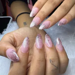 Another angle of this stunning glitter fade manicure. The way the light catches the different sizes of glitter creates a truly dazzling and dimensional effect.