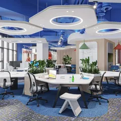 This is an example of a vibrant, open-plan office designed to foster collaboration. The hexagonal ceiling panels with integrated lighting, colorful accents, and strategically placed planters create an energetic and modern atmosphere.