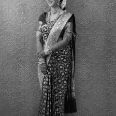Engagement perfection in black and white. This image captures the timeless beauty of a well-draped saree, with every pleat and fold contributing to a look of pure grace.