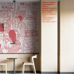 Another angle of the Netflix mural, showing how the artwork interacts with the physical space and architecture. The text column lists keywords that inspired the piece.