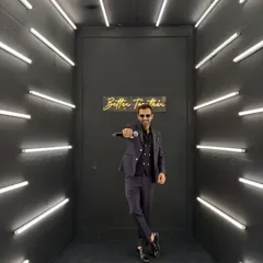 I am not just a host, I am a full blockbuster package. Here I am, mic in hand, ready to bring the energy in a stylish photo booth before a sangeet, a look perfect for a corporate gala night.