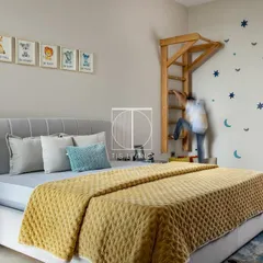 Our furniture is made for real life. Here you can see the wooden ladder in action, providing a fun and active element to the room's design. It's both a decorative piece and a source of endless fun.