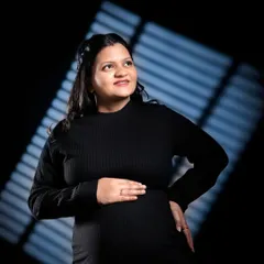 Another example of using creative lighting patterns. The diagonal light adds interest and dimension to this portrait against a dark background.