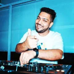 A simple thumbs-up from the DJ booth. This is me giving a nod to the crowd, feeling the vibe, and enjoying the music as much as they are.