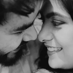 An extreme close-up in black and white, focusing on the intimate space between the couple. This artistic shot is all about emotion and connection.