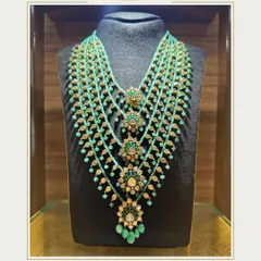 The Satlada necklace is a piece of royal history, emphasizing symmetry and richness. This modern Satlada, made with real Polki in 22k gold, is a nod to its regal past and a statement of timeless luxury for any bride.
