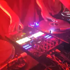 A close up of my hands on the turntables during a live set. This is where the magic happens. I treat turntablism as an art, using scratching and mixing on vinyl to build energy that you can't get from just pressing play.