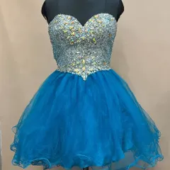 This short and flirty blue frock is perfect for a birthday party or a fun pre-wedding shoot. The bodice is covered in sparkling crystals, adding a touch of glamour.