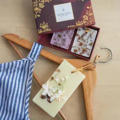 Scent up your scene with our stylish, handcrafted wax tablets. Here, a tablet infused with white flowers and coffee beans is clipped to a hanger, ready to add a whiff of alluring fragrance to your wardrobe.