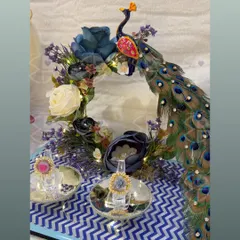 For your engagement, the ring platter should be as unique as your love story. This peacock-themed ring platter, adorned with rich blue and white florals and twinkling lights, creates a magical moment for the ring exchange ceremony.
