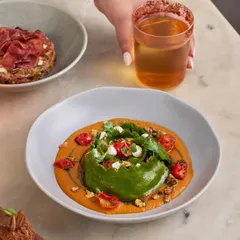 Comfort on a gloomy day. Our Spinach and Ricotta Crown Raviolo, served with a charred tomato and miso sauce, toasted walnuts, and goat cheese, is the perfect cozy meal.