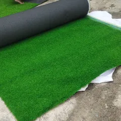 A roll of our high-quality artificial turf, ready for installation. The dense fibers and rich green color provide a realistic look and feel.