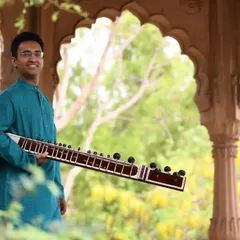 A portrait taken in Vrindavan, with beautiful traditional Indian architecture in the background. This reflects the deep cultural roots of my music.