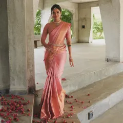Celebrating National Handloom Day in a beautiful pink Kanchivaram. I paired it with a custom blouse featuring delicate embroidery on sheer sleeves.