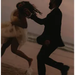 Running along the shoreline as the sun goes down. I love capturing this playful, carefree energy, where the couple can just be themselves and enjoy the moment.