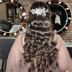Another view of this beautiful curly hairstyle. I make sure every curl is perfectly defined and glossy, creating a look that is full of movement and life.