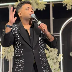 A close-up of my black jacket with scattered crystal embellishments. It's a modern, stylish choice that adds a touch of sparkle and sophistication to any event.