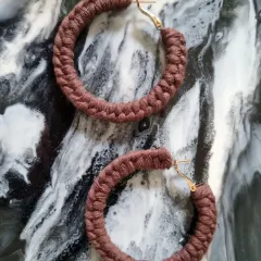 These hoop earrings in a muted, earthy brown are perfect for a subtle, natural look.