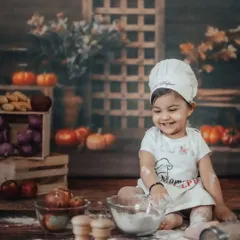 Look at that smile. Our 'Little Chef' themed shoot is filled with giggles and playful moments. I love creating these imaginative setups where kids can just be kids.