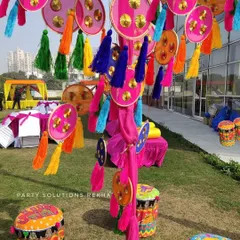 I love playing with textures and colors. For this outdoor Mehendi, I used hanging props with colorful tassels and hand painted drums as seating, creating a fun and festive atmosphere.