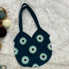Here is another variation of my granny square tote, this time in a deep blue with a geometric floral pattern. I can create these bags in any color combination you like.